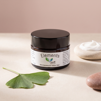 Capelli Emotions Gesichtscreme Elements mit Ginkgoblatt auf cremefarbenem Marmor