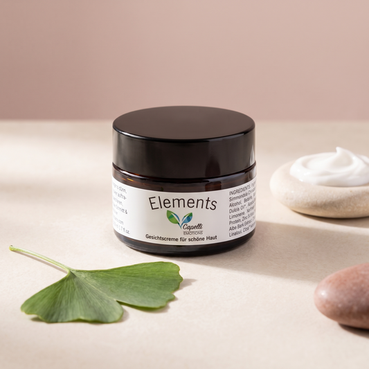 Capelli Emotions Gesichtscreme Elements mit Ginkgoblatt auf cremefarbenem Marmor