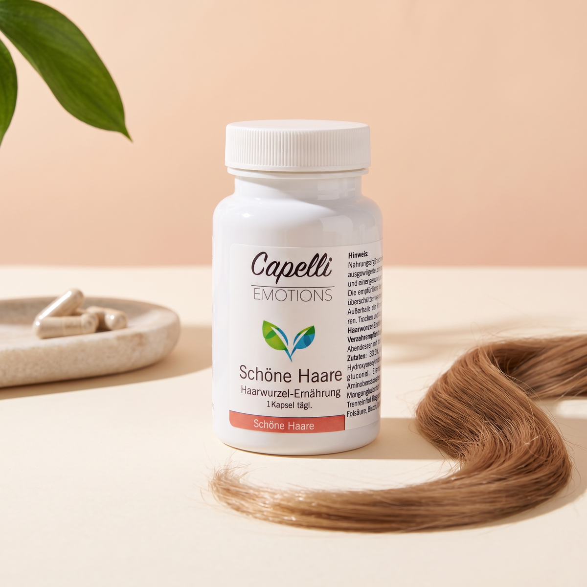 Capelli Emotions Kapseln Schöne Haare mit Haarsträhne auf Steintablett